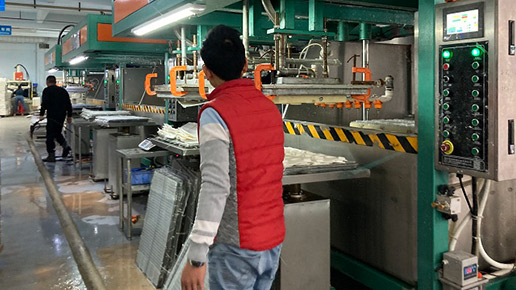 Worker is using molding machine